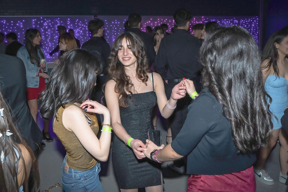 Senior Christie Ghazarian parties with her two friends on the dance floor.