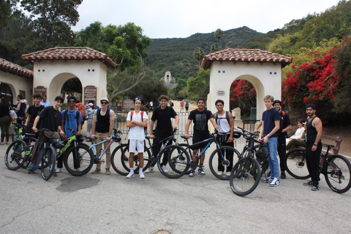 Seniors Michael Jierjian, Dylan Safari, Noah Kurien, Albert Poghosyan, Nathan Safarian, David Bartecek, Anthony Sarkisian, Eron Paywal, Taggart Gates, Eden Azorian, Albert Ghevondyan take a break from biking and take a group picture.