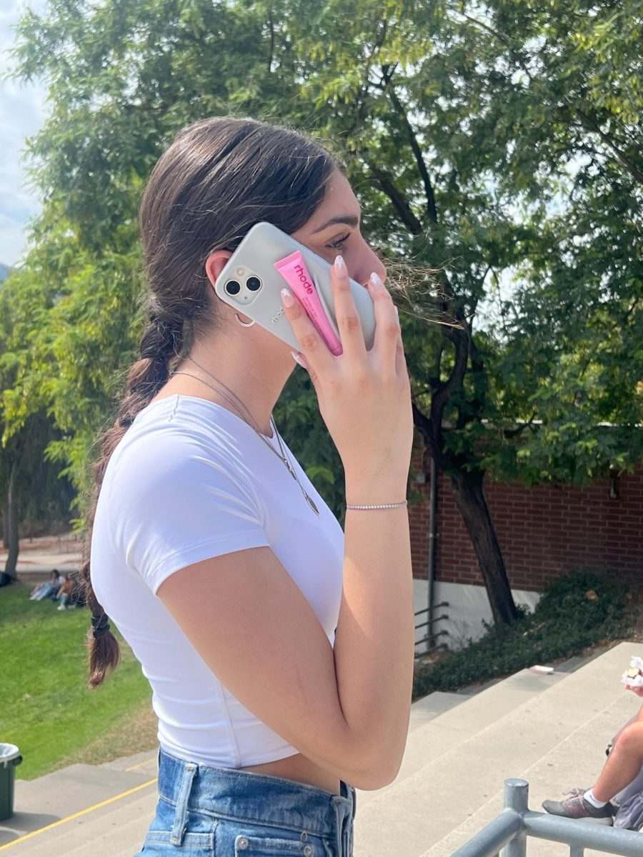 Junior Mane Araratyan posing with her Rhode phone case.