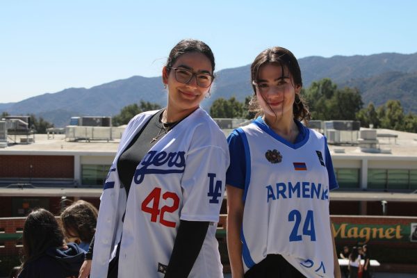 Seniors Talia Zadourian and Ani Handian posing in their favorite jerseys.
