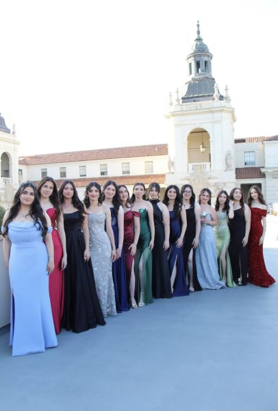 A large group of students took prom photos at the Pasadena City Hall due to the beautiful architecture of the surroundings. 
