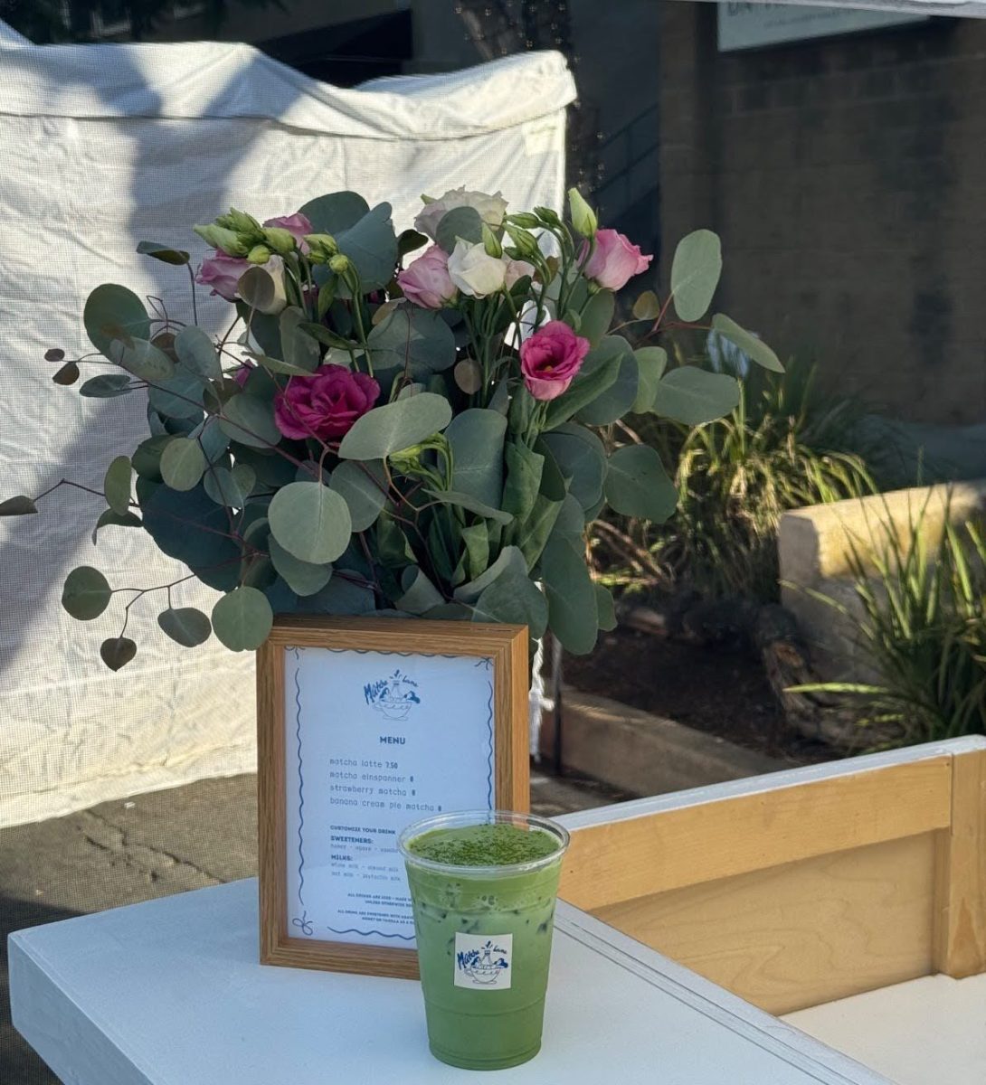 The refreshing sight of beautiful flowers and a bright green matcha latte. 