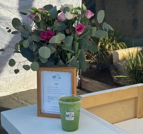 The refreshing sight of beautiful flowers and a bright green matcha latte. 