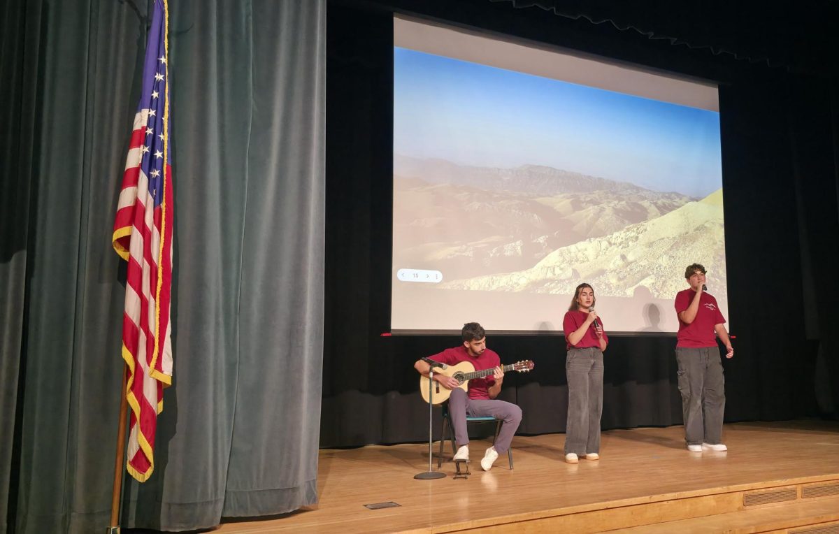  Senior Aram Minasyan, junior Agnes Hambardzumyan, and senior Shant Gyurjyan perform the song “Msho Gorani."