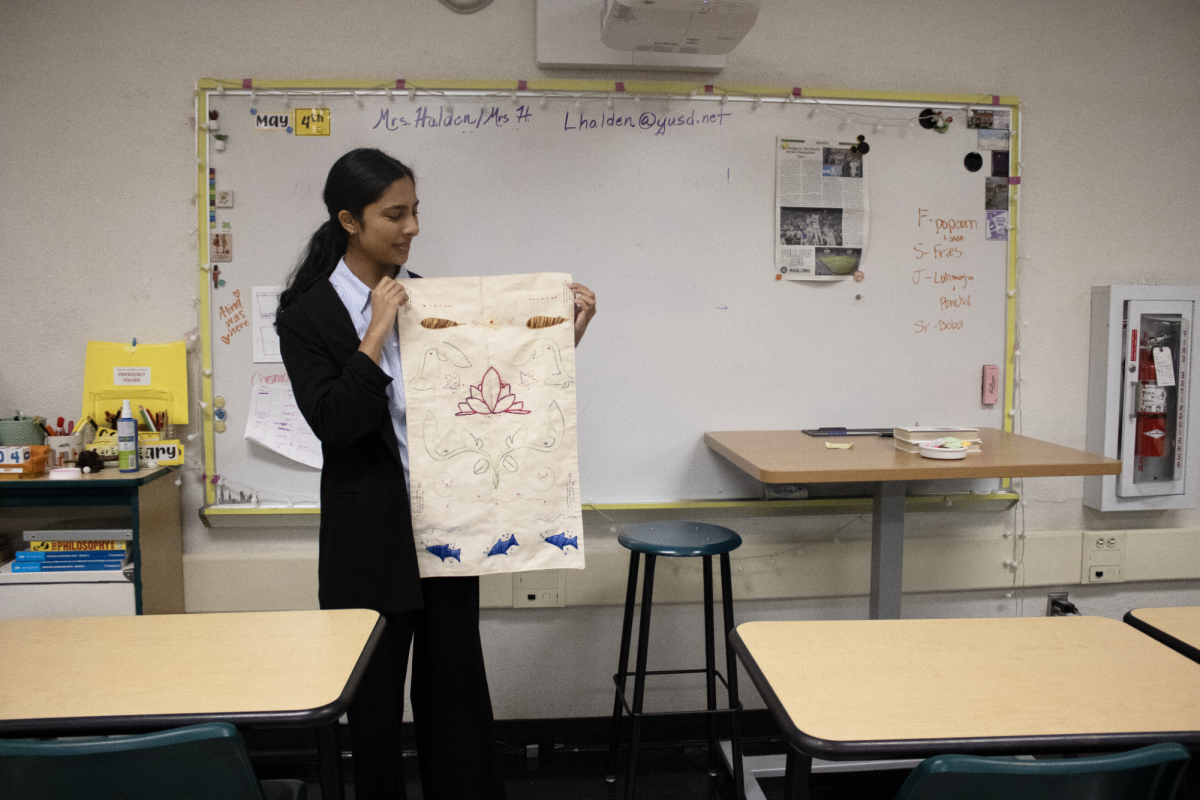 Mehreen Azad presenting her embroidery project during oral boards.