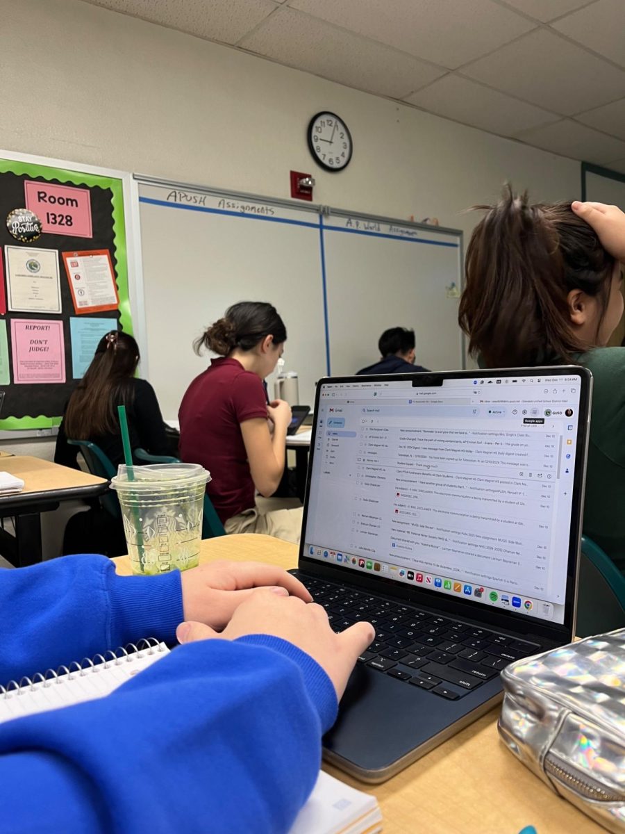 Even during class, students check emails and assignments, reflecting the constant academic responsibilities they balance throughout the day. 